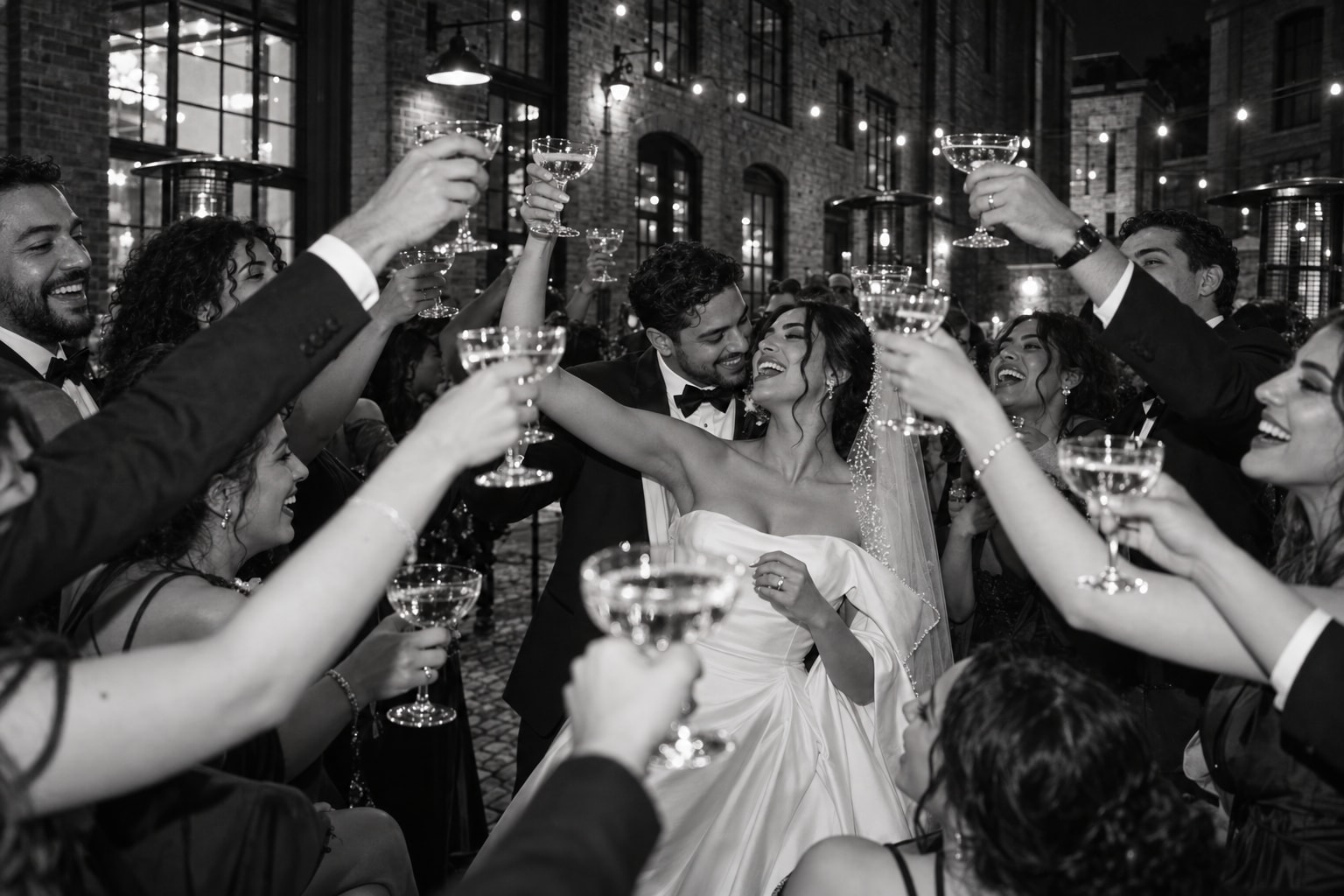 A wedding party toasting in the Distillery District